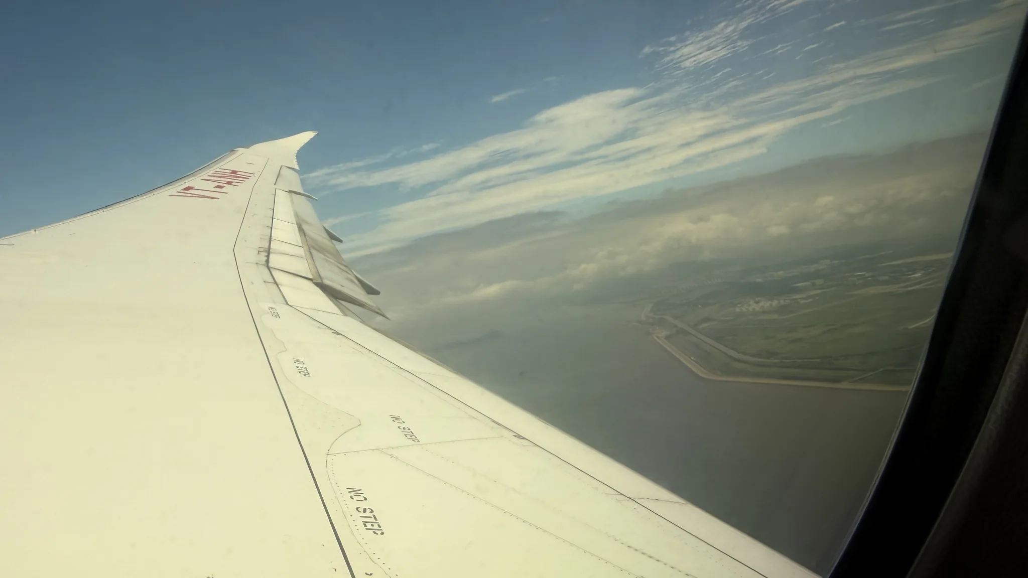 View of the wing and sky from my flight