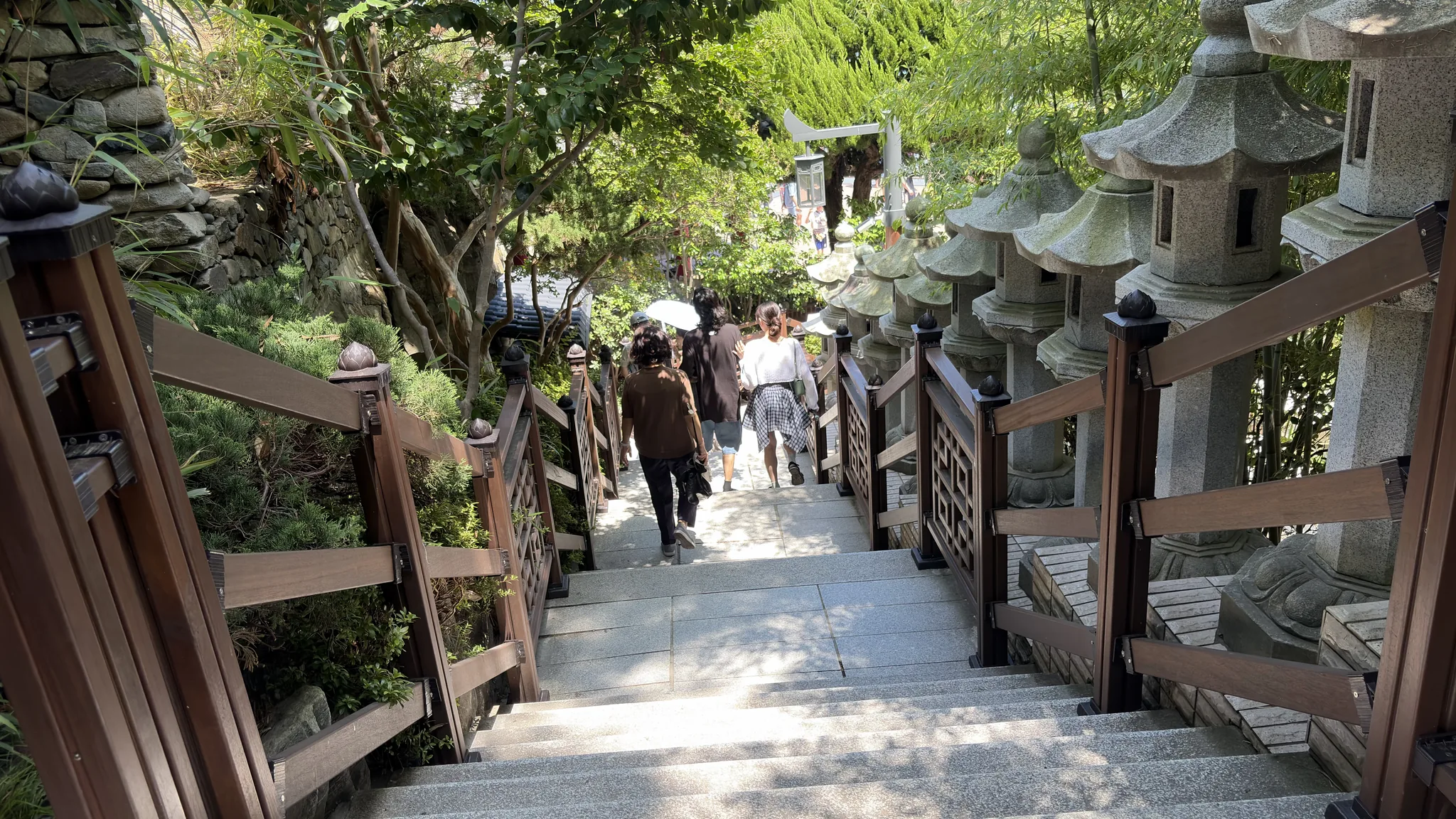 Stone stairway and lanterns on the path to Haedong Yonggungsa Temple