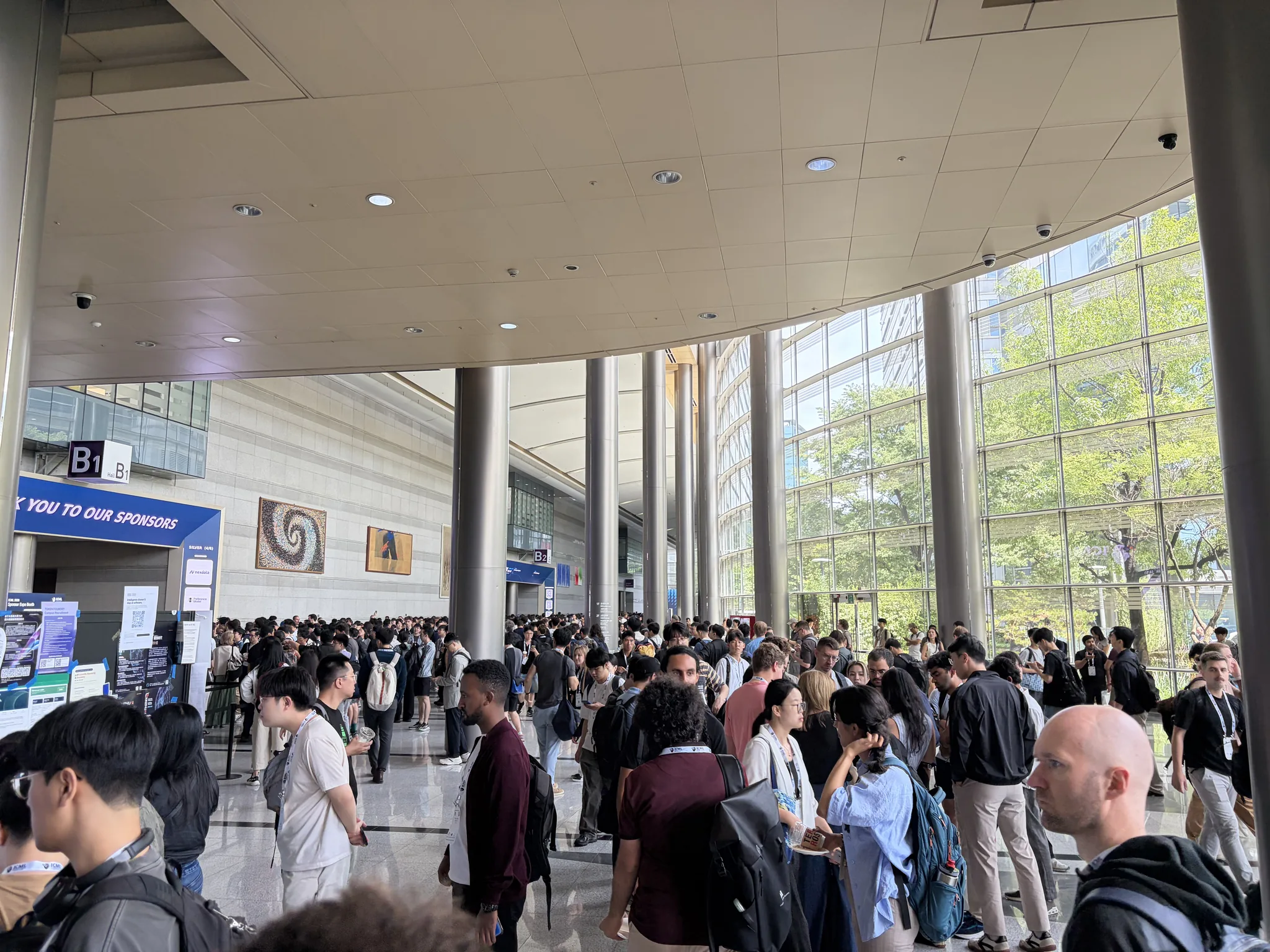 Crowd of attendees inside the ICML 2026 venue