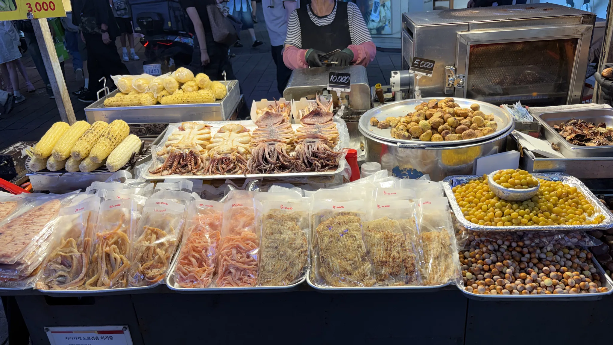 Seafood and other food displayed at a Myeongdong street stall